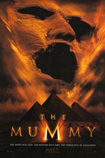 The Mummy movie poster showing the face of the mummy in sand above the pyramids in shadow