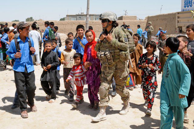 female soldier with children