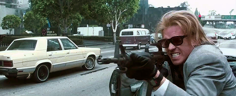 Val Kilmer shooting in the streets in 1995's Heat