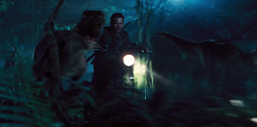 Chris Pratt as Owen in Jurassic World rides with the raptors