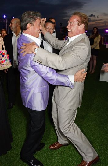 Sylvester Stallone dances with Arnold Schwarzenegger at the Cannes 2014 Expendables 3 party