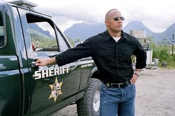 Dwayne Johnson as Sheriff Chris Vaughn with his green pick up truck from Walking Tall