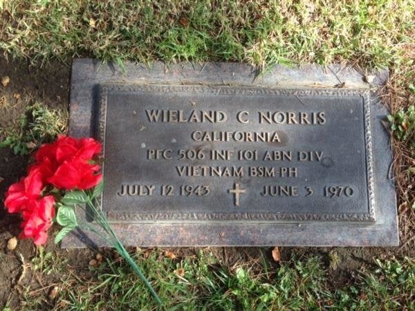 Wieland Clyde Norris grave plate reads WIELAND C NORRIS line break CALIFORNIA line break PFC 506 INF 101 ABN DIV line break VIETNAM BSM-PH line break JULY 12, 1943 then a cross then JUNE 3, 1970