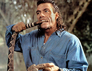 Jean-Claude van Damme bites the tail off a rattlesnake in John Woo's Hard Target